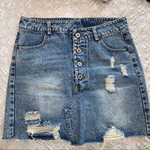 Distressed asymmetrical denim skirt